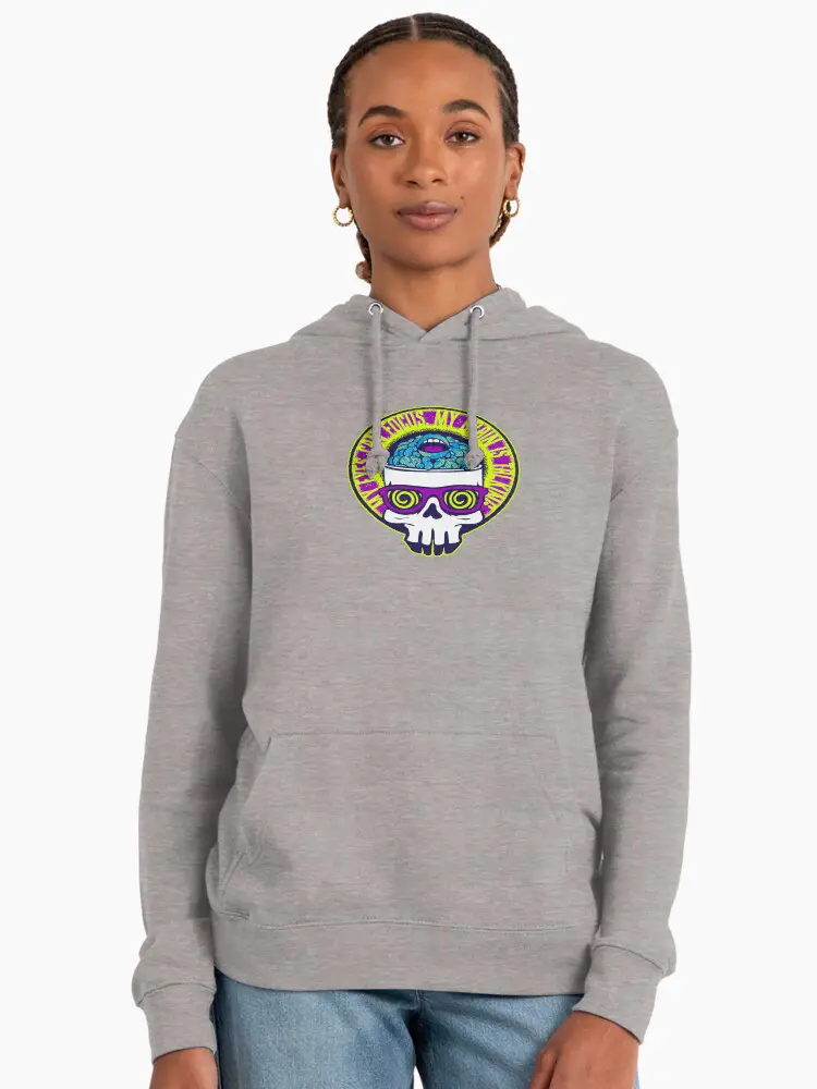 A woman wearing a heather grey pullover hoodie with a circular trippy skull graphic, demonstrating the relaxed-fit streetwear trend popular in the US and Europe.