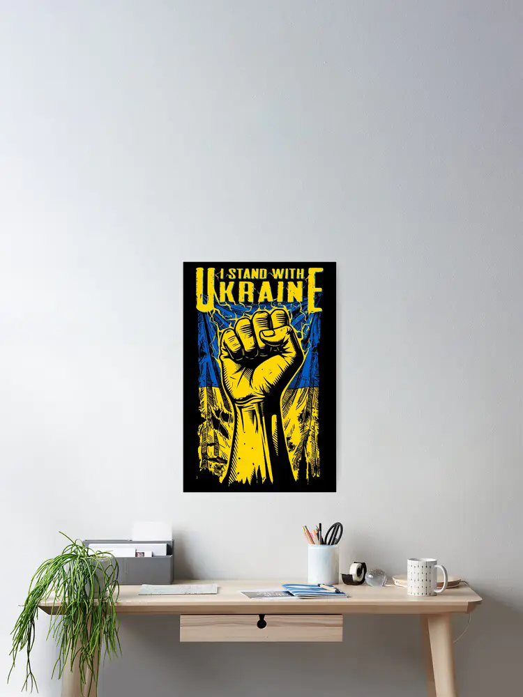 A professional desk featuring a framed 'I STAND WITH UKRAINE' poster, demonstrating the design's suitability for home offices and workspaces committed to democratic values.
