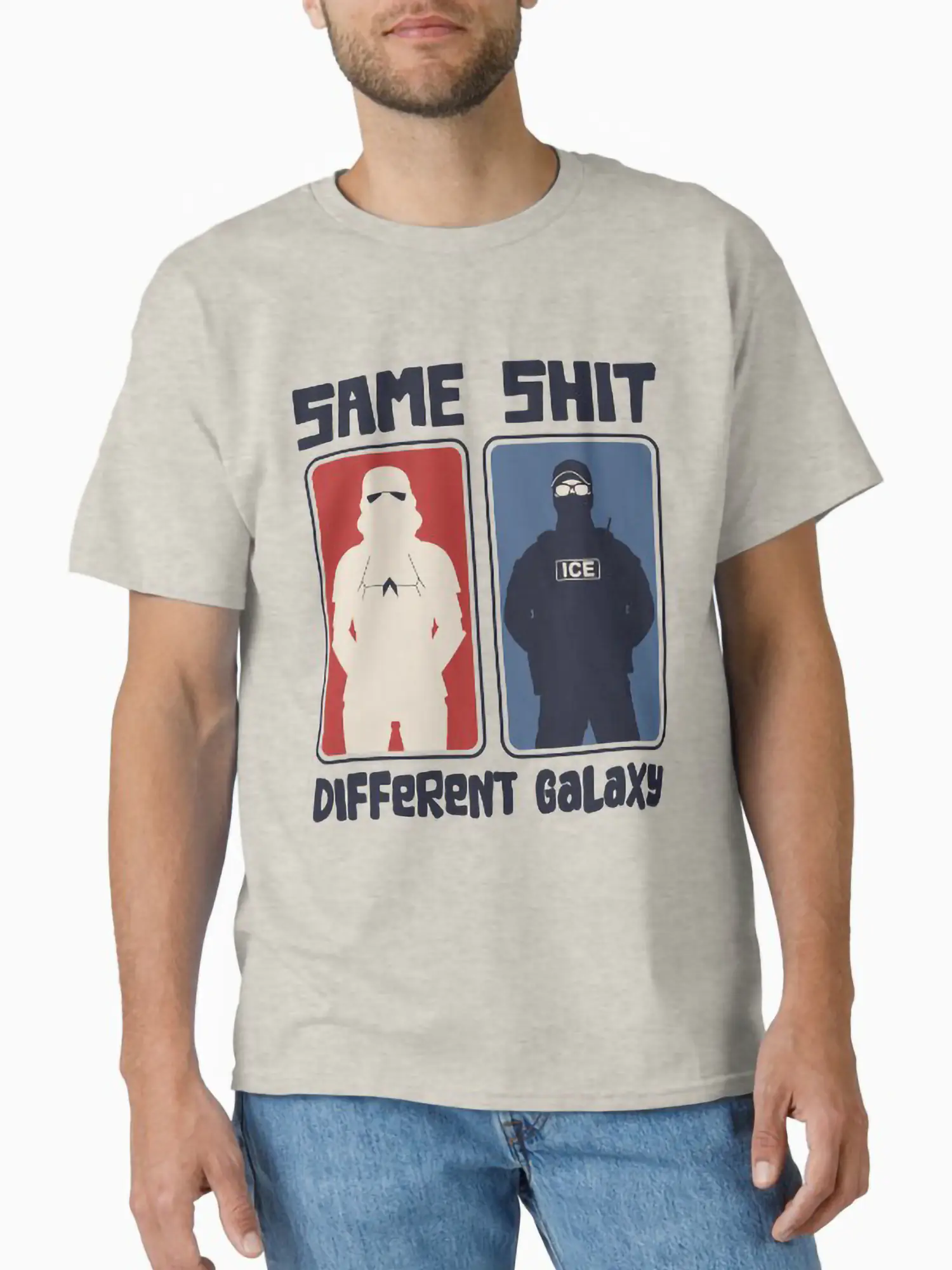 Man wearing a light grey t-shirt featuring the "Same Shit Different Galaxy" graphic in red and blue panels.