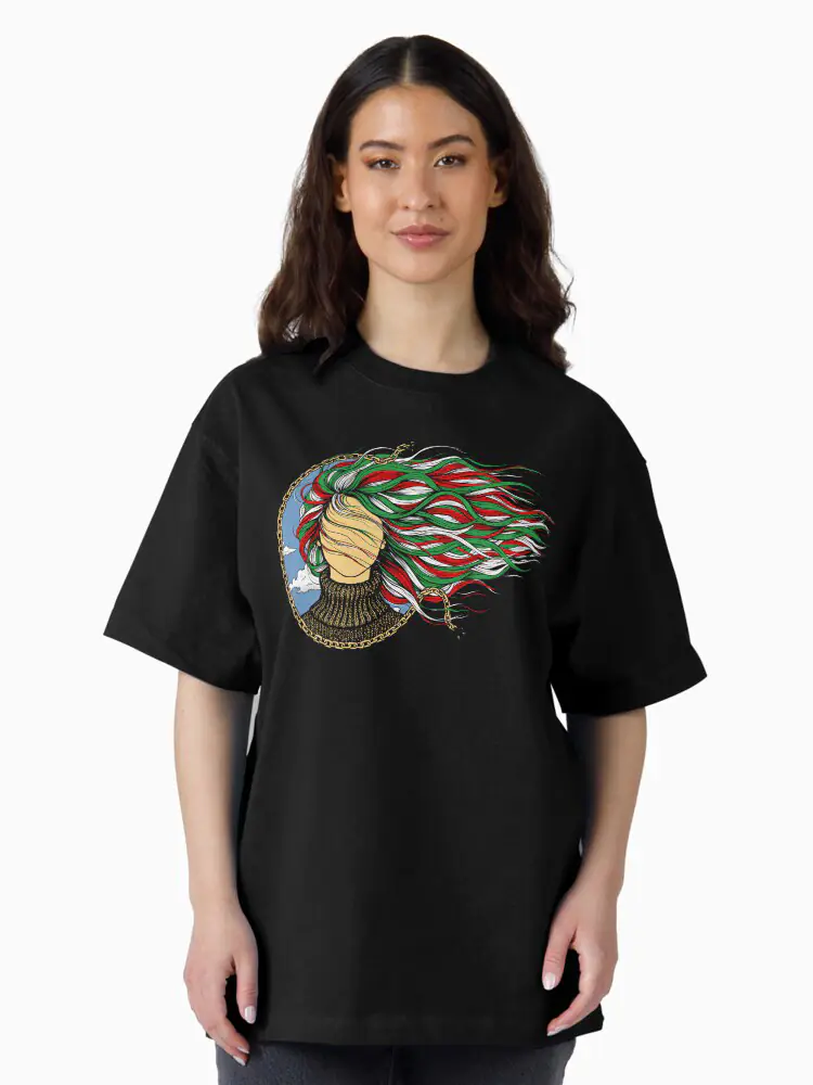 A woman wearing a black oversized t-shirt with the bold female figure silhouette and broken chains, representing strength and the desire for a freer future.