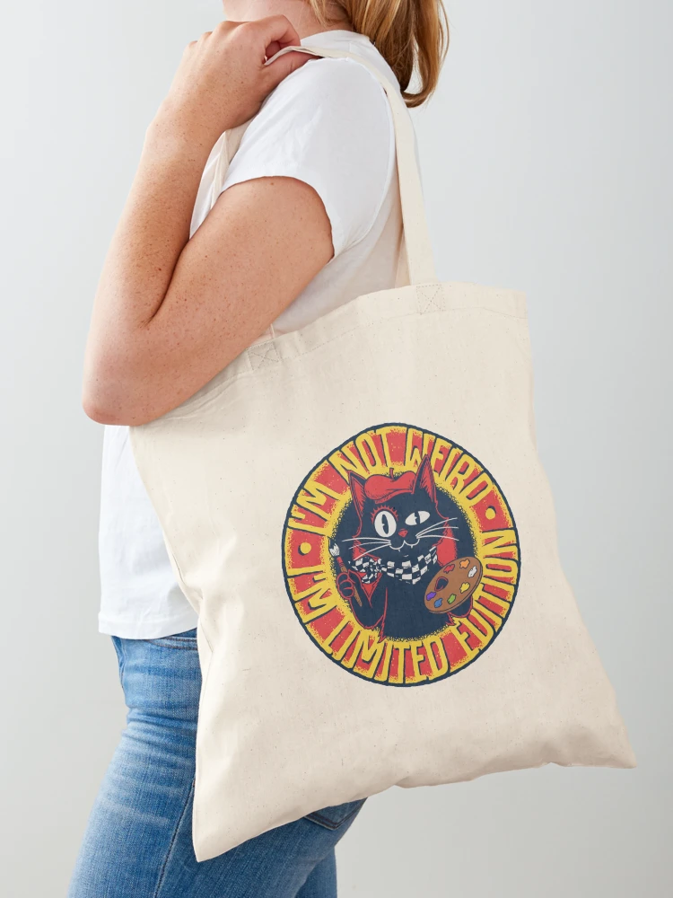 Canvas tote bag with a funny black cat artist limited edition circular vintage badge design