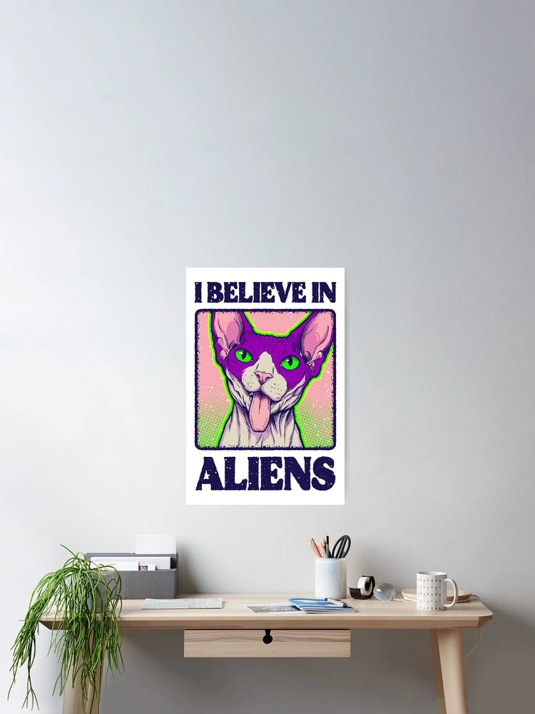 Framed vertical art poster of a psychedelic alien cat design displayed on a modern wooden desk.
